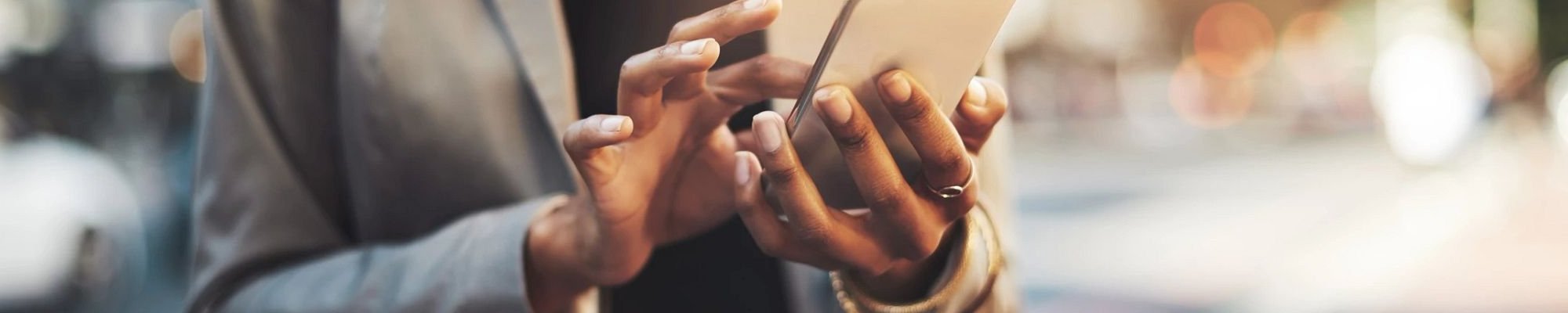 person using smartphone - The Carpet Shoppe Inc in Tulare, CA