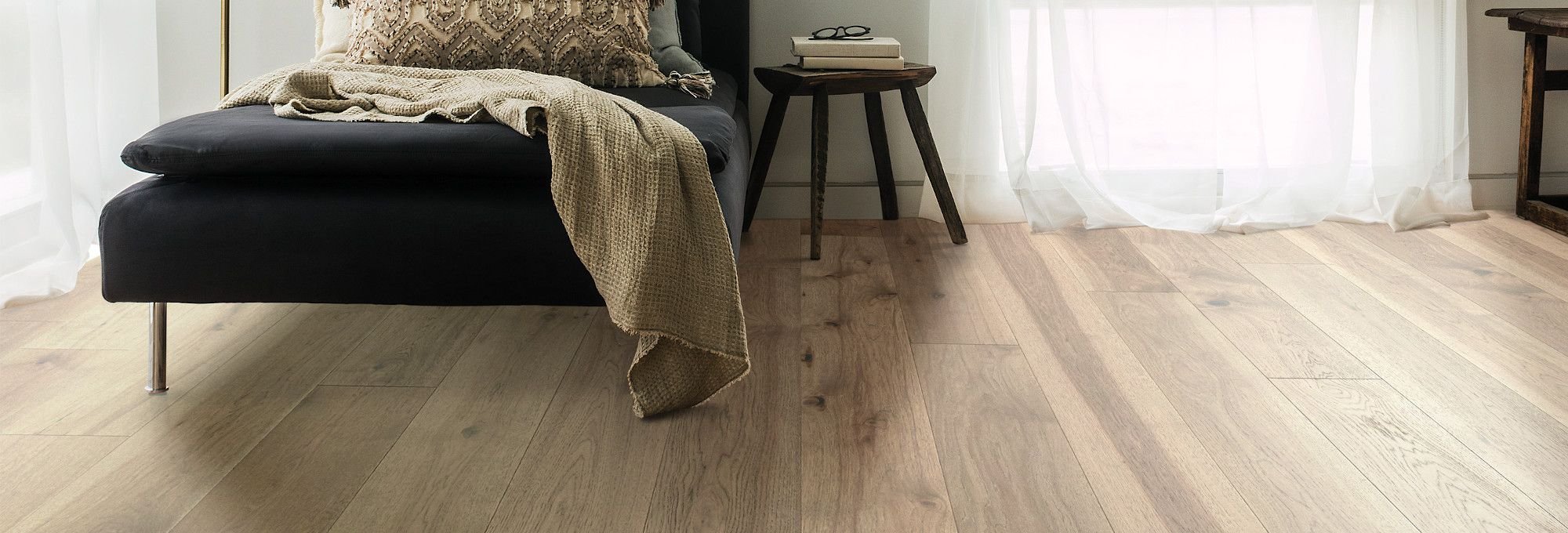 Bedroom with hardwood flooring from The Carpet Shoppe Inc in Tulare, CA