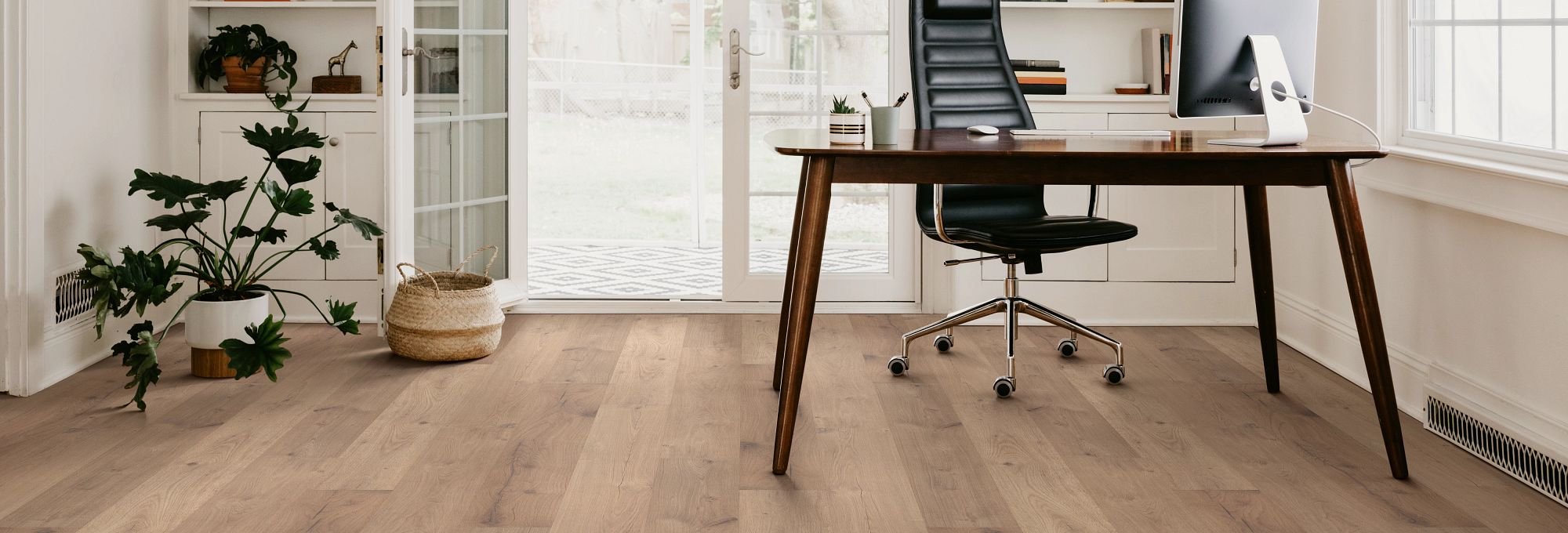Office with wood-look laminate flooring from The Carpet Shoppe Inc in Tulare, CA