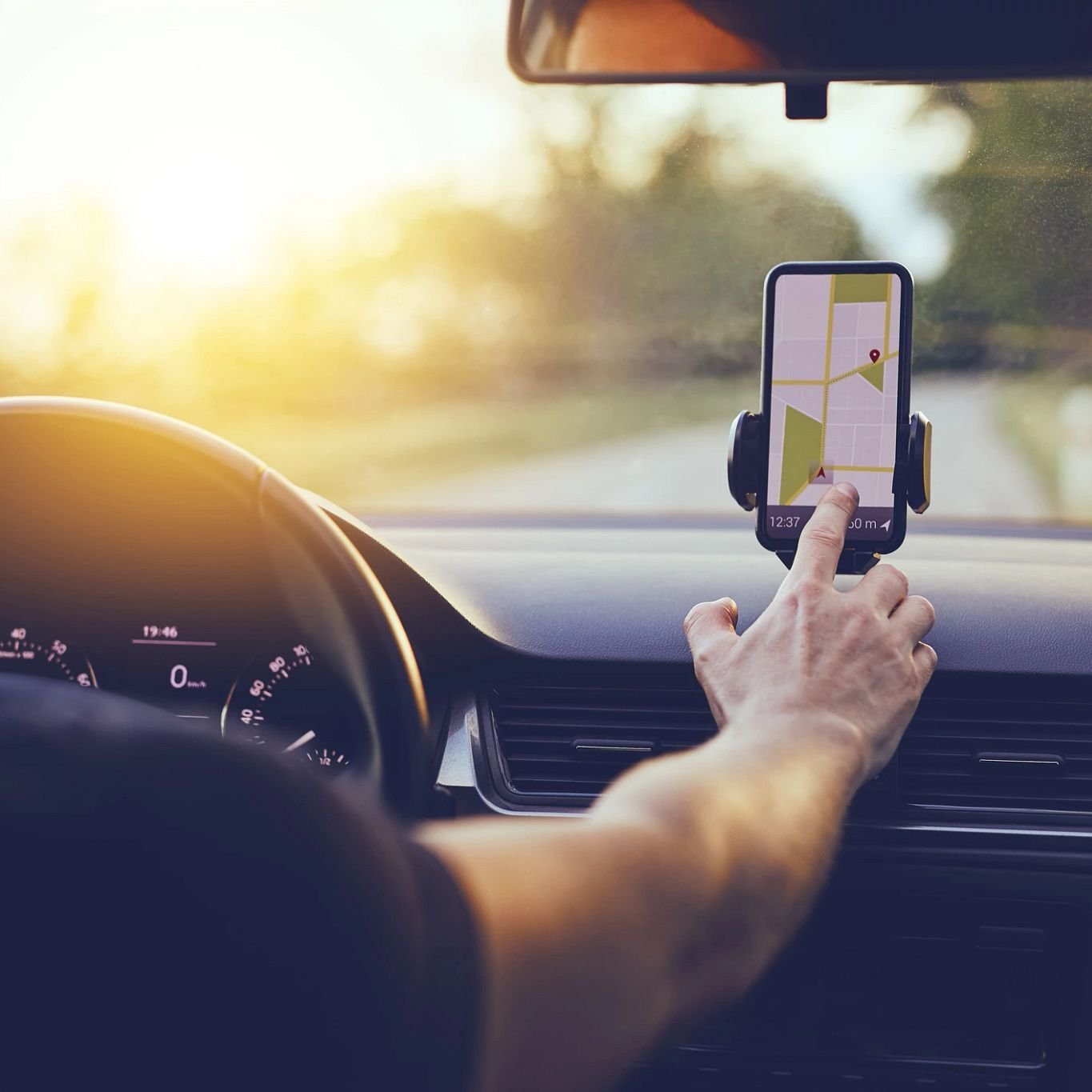 Person using GPS on phone while driving - The Carpet Shoppe Inc in Tulare, CA