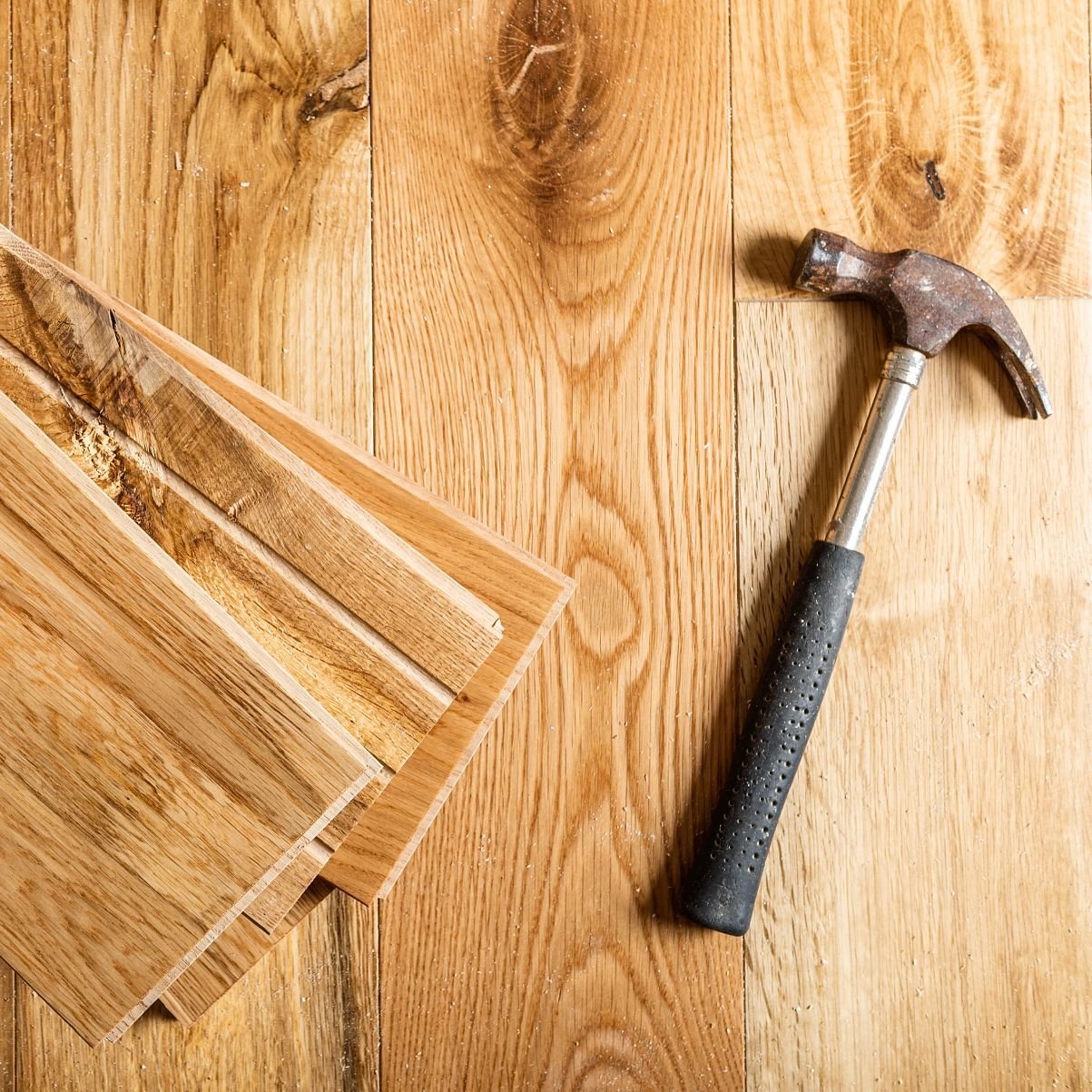 Hammer on hardwood planks - Hardwood flooring installation services from The Carpet Shoppe Inc in Tulare, CA