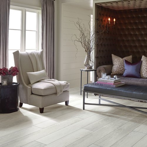 Elegant living room with wood-look luxury vinyl flooring from The Carpet Shoppe Inc in Tulare, CA