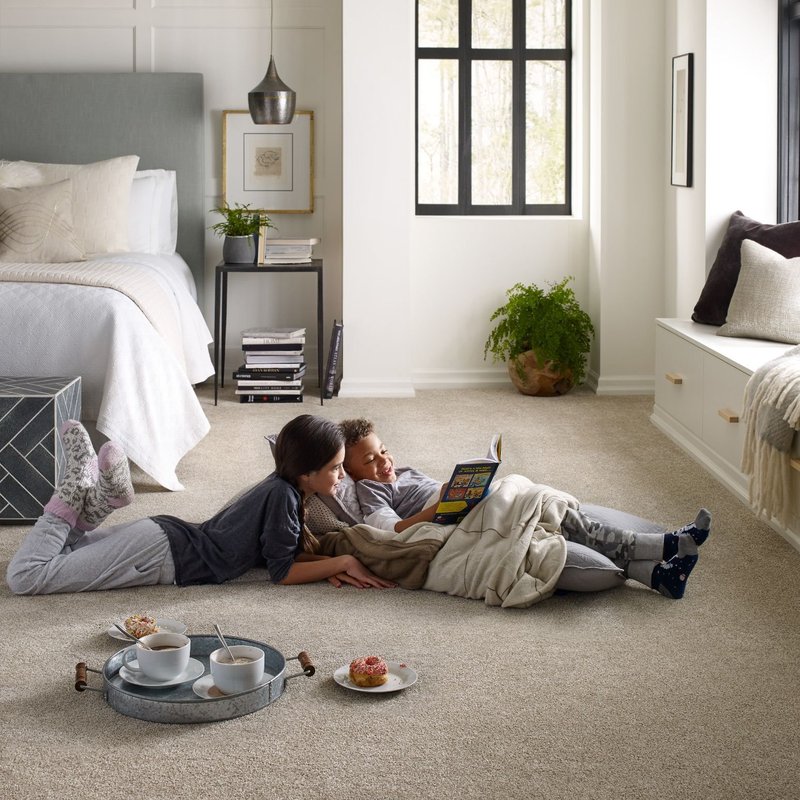 Kids reading on bedroom carpet from The Carpet Shoppe Inc in Tulare, CA